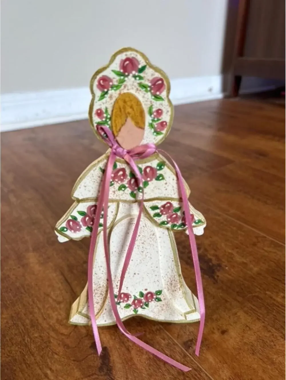 Vintage Wooden Wall Hanging Doll with Floral Design and Pink Ribbon